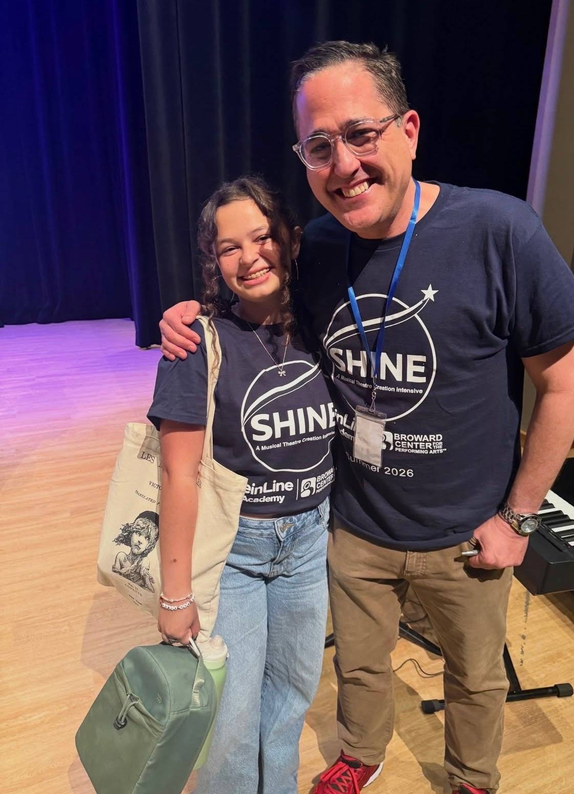 Composer Brian Feinstein with a SHINE student on stage