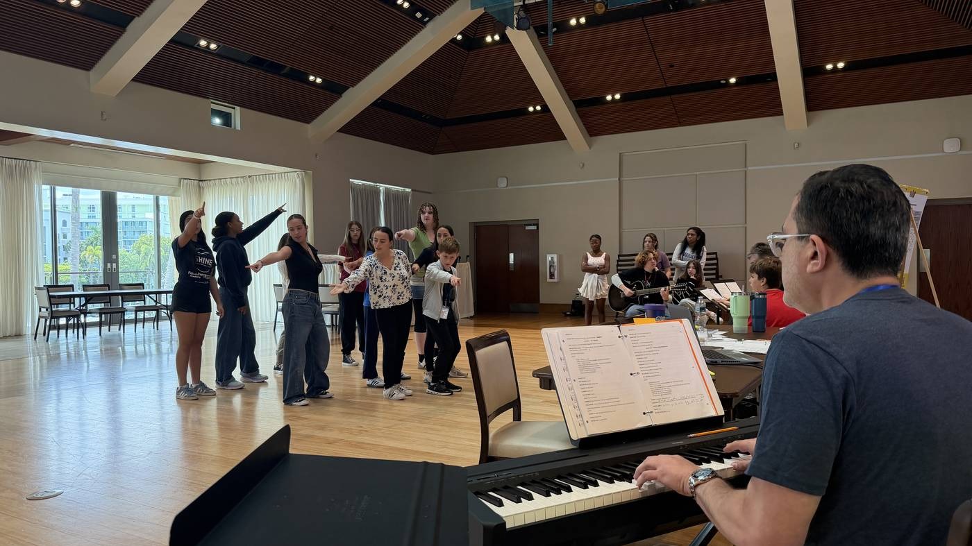 Students rehearsing staging